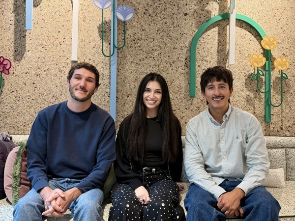 a group of people sitting on a bench