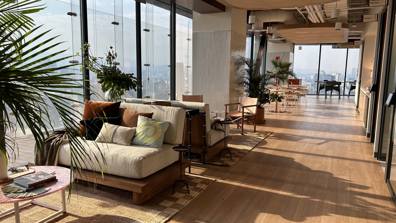 a room with a large window and a couch