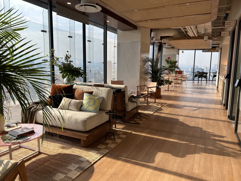 a room with a large window and a couch