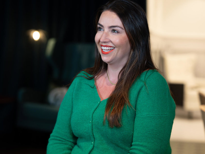 a person in a green sweater