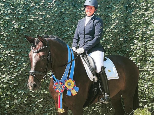 a woman riding a horse