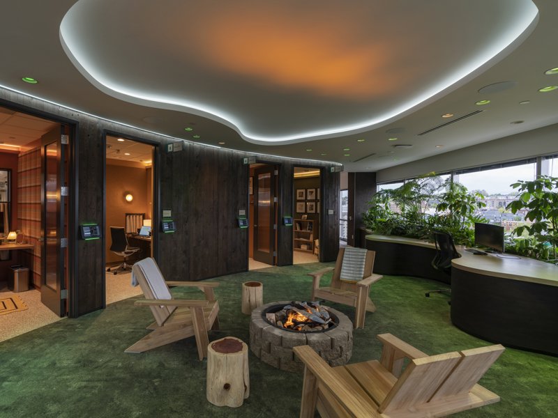 a room with chairs and a fire pit