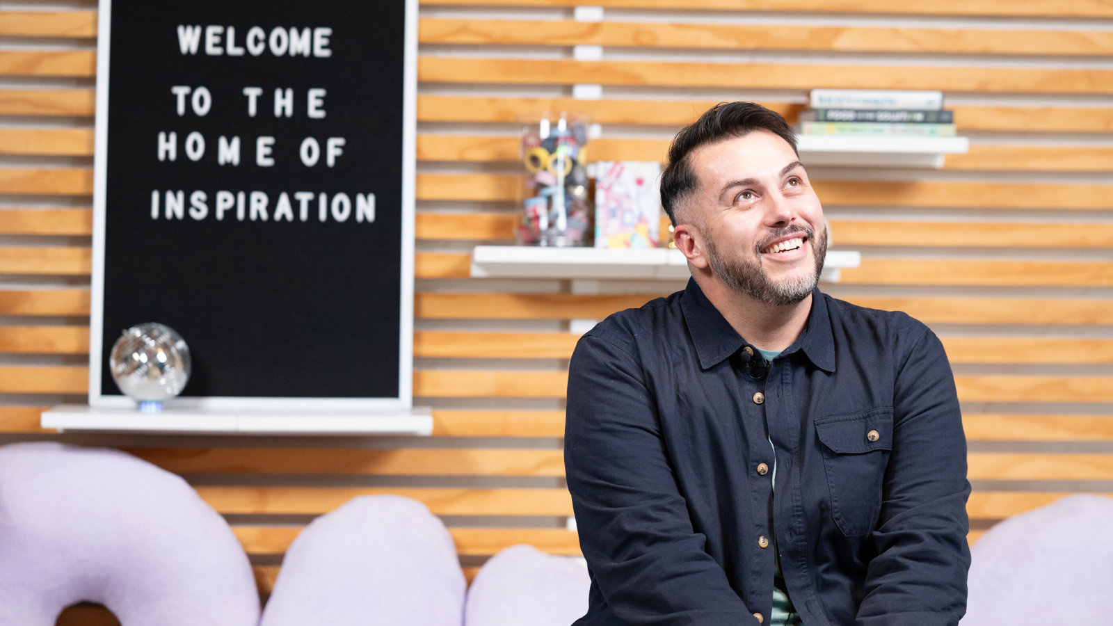 a man sitting on a couch looking up