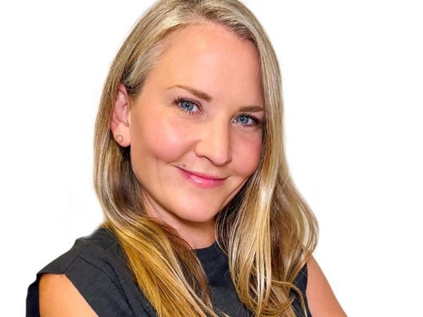 a person with blonde hair and blue eyes