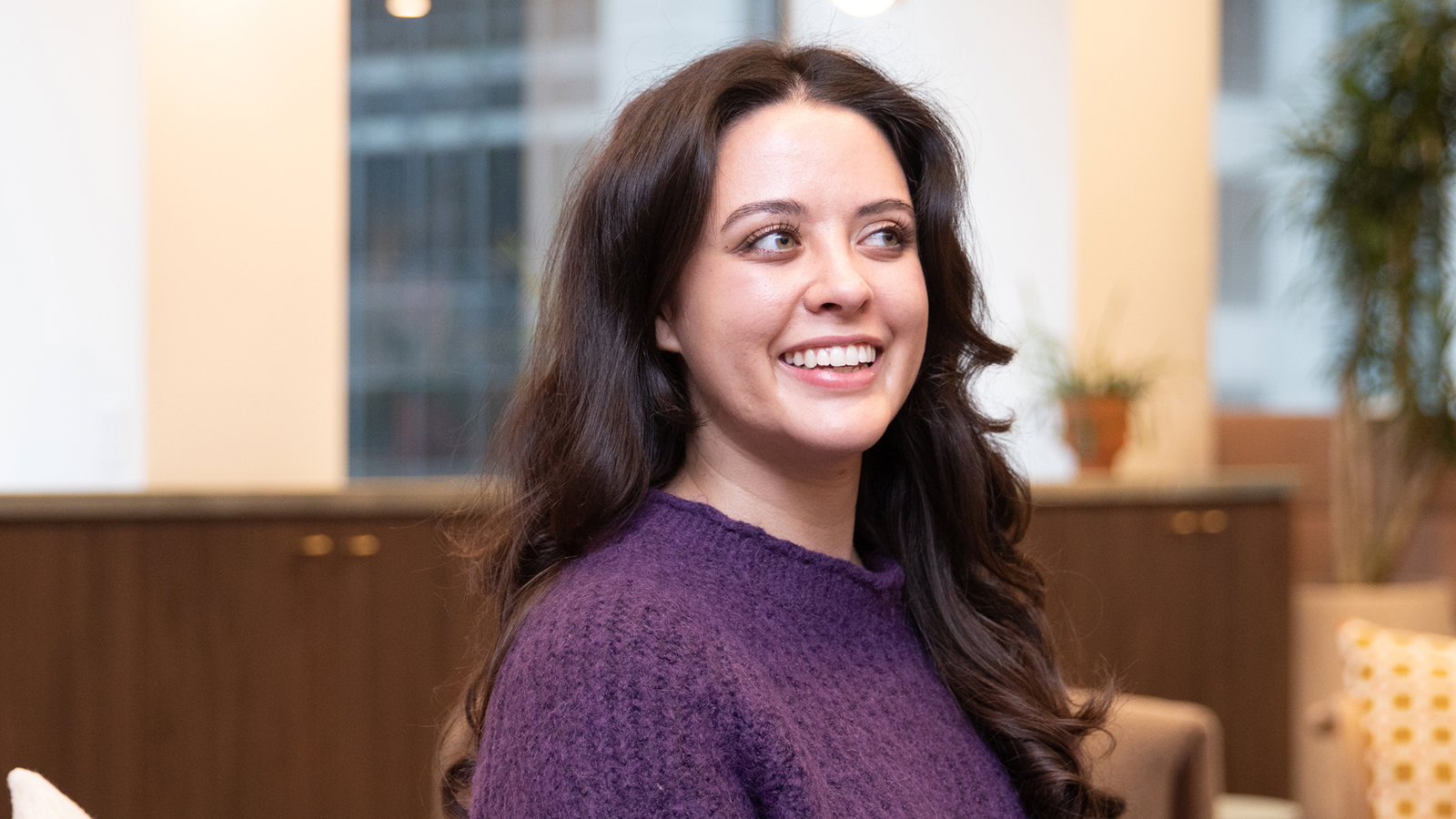 a person in a purple sweater