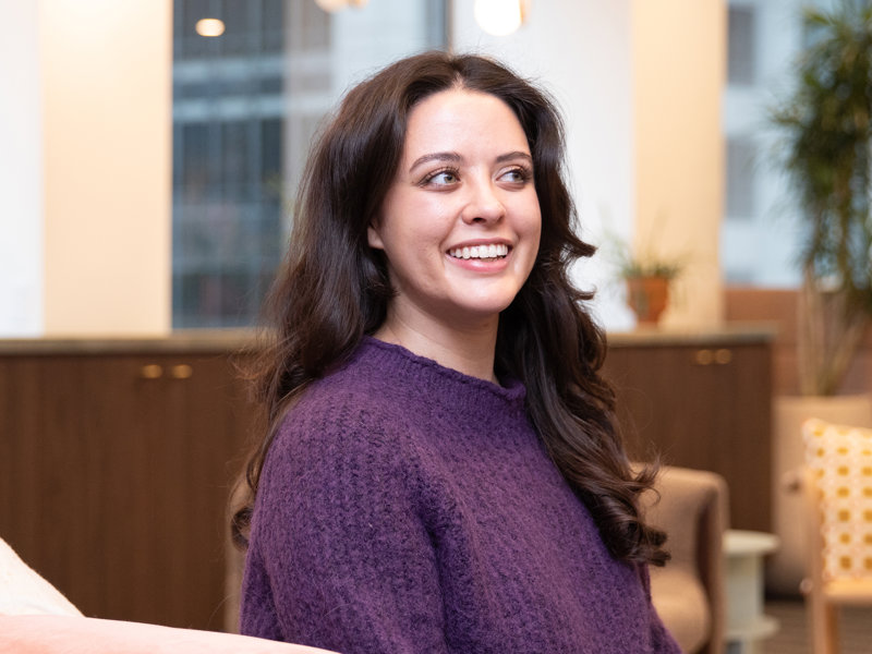 a person in a purple sweater