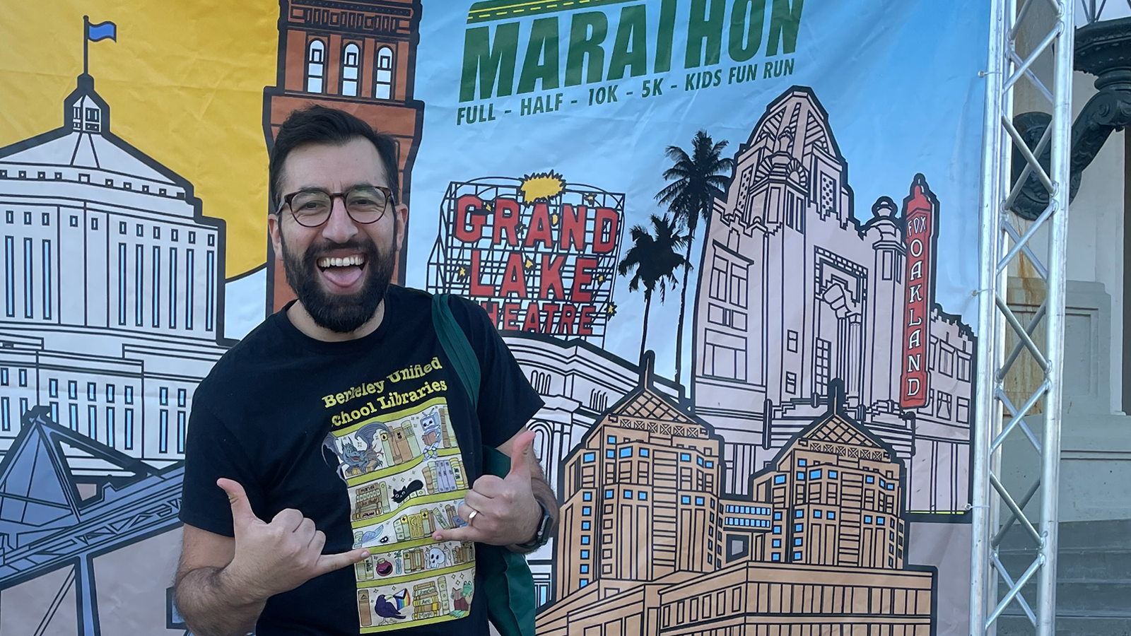 a person standing in front of a banner