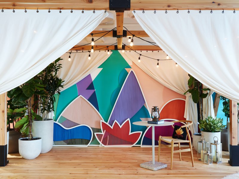 a room with a table and chairs and a table with lights