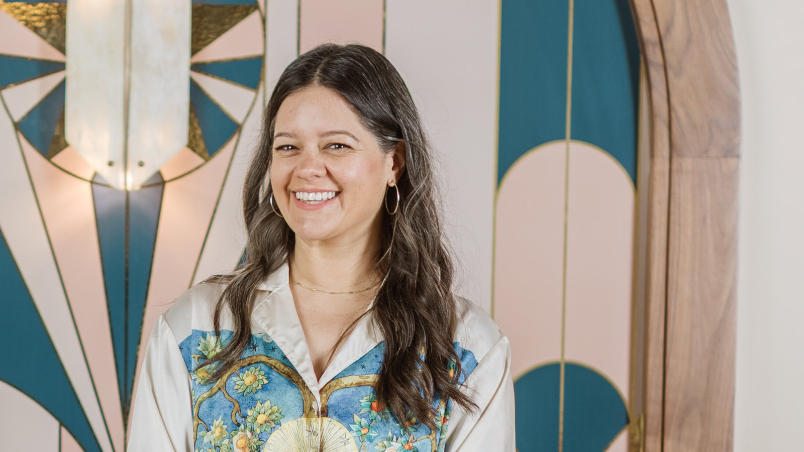 a person standing in front of a stained glass door