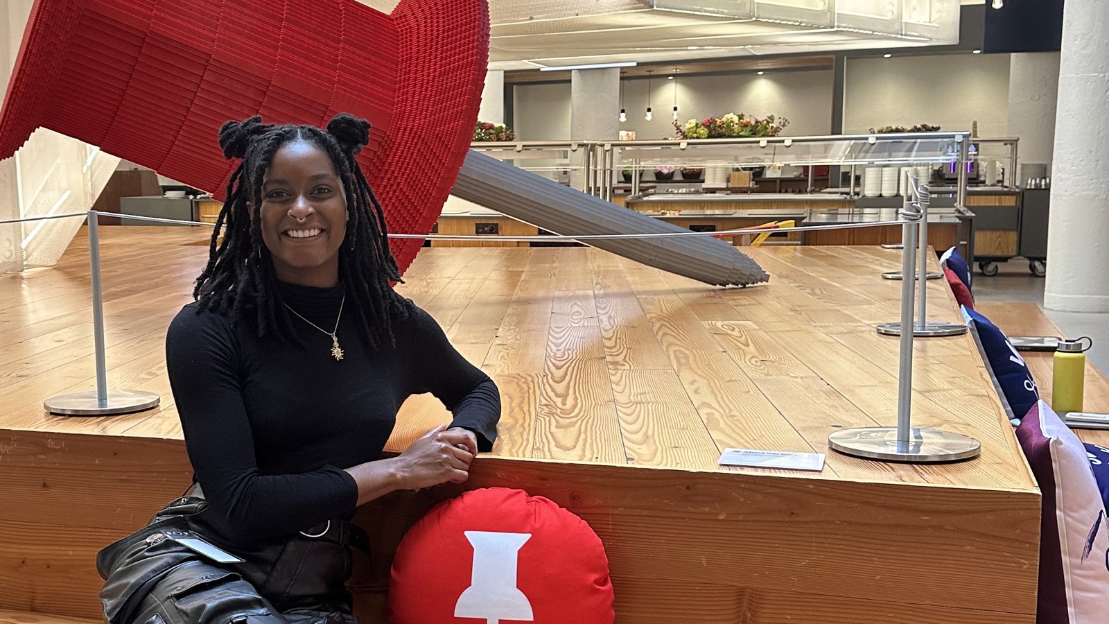 a woman sitting on a wooden staircase