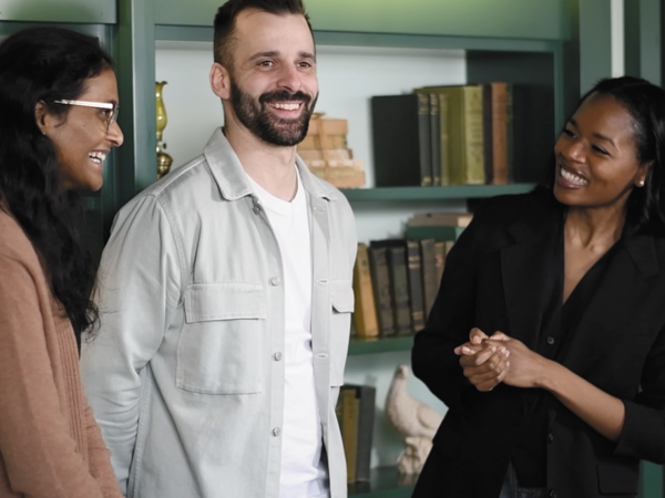 a group of people standing in a room