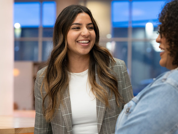 a woman smiling at someone