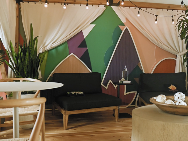 a room with a couch and chairs