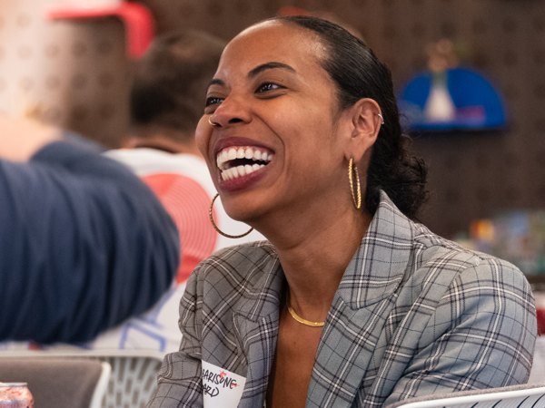 a person laughing with a smile