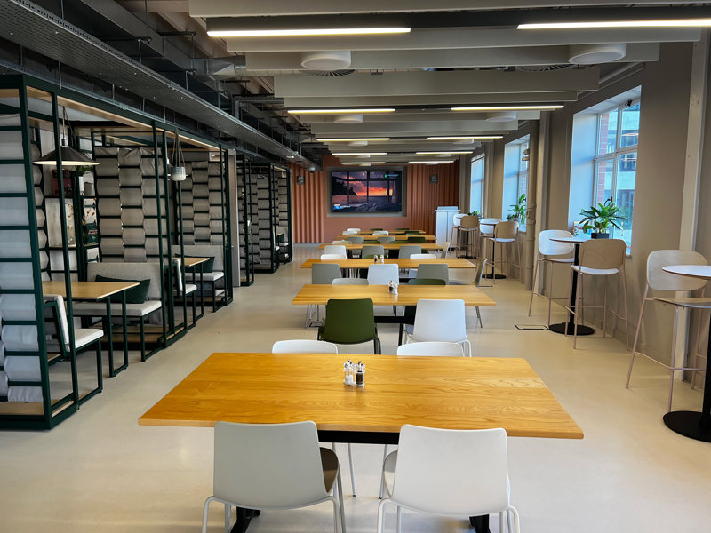 a room with tables and chairs