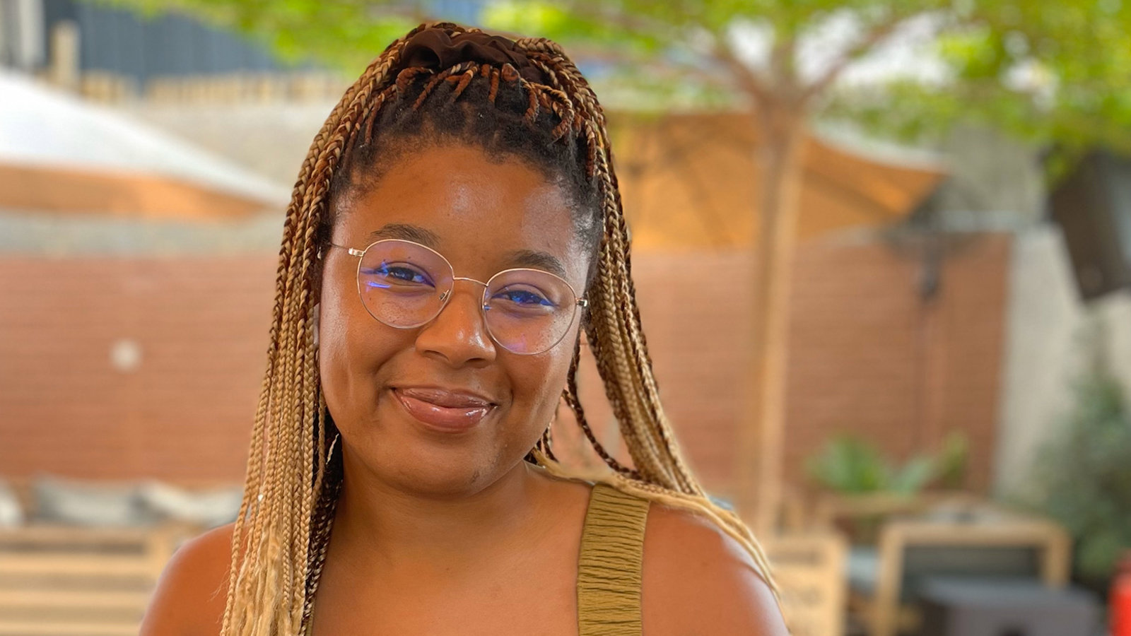 a woman sitting at a table with a laptop