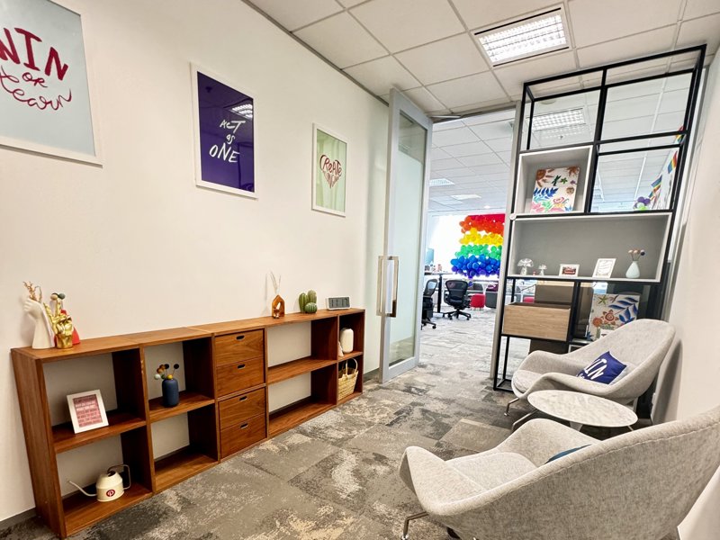a room with chairs and shelves