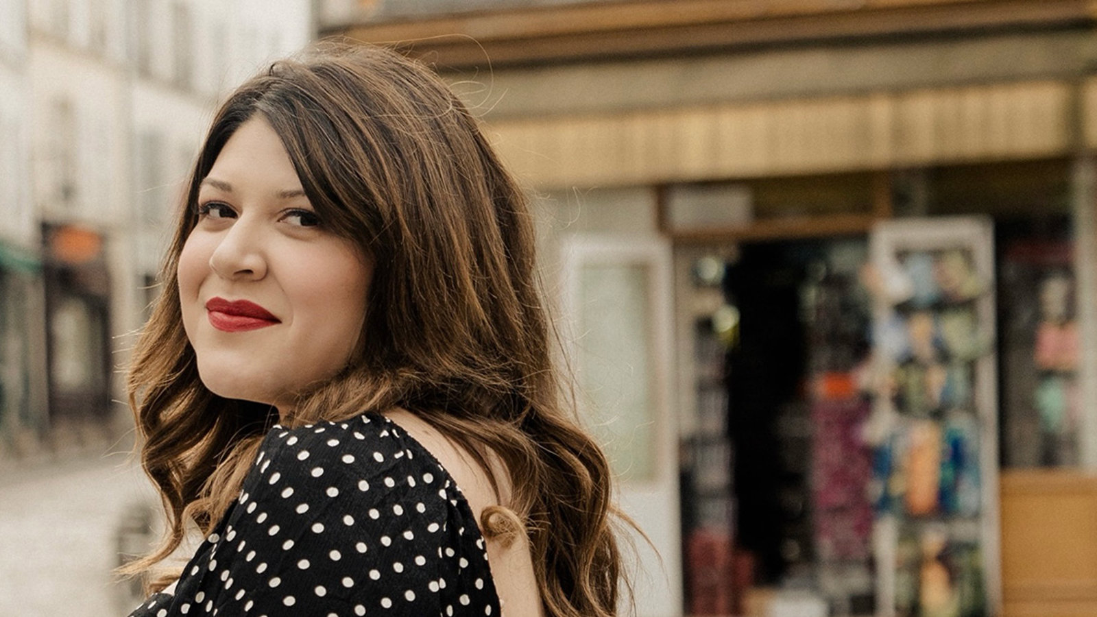 a woman in a polka dot dress