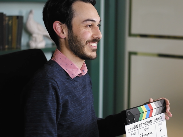a person holding a clapper board