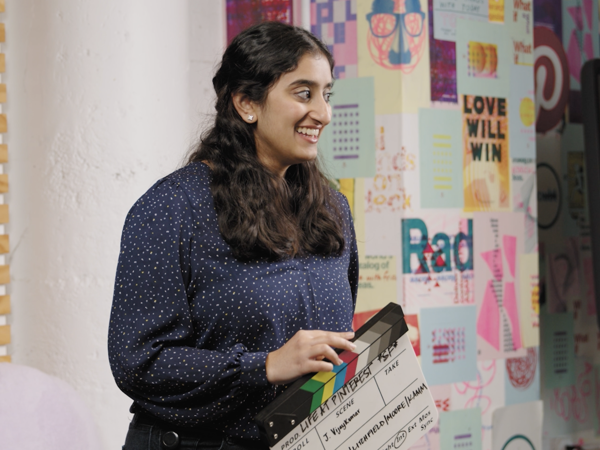 a person holding a large paper