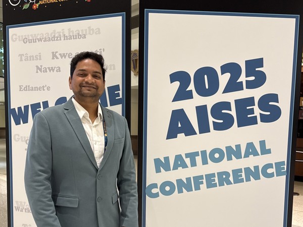 a person standing next to a sign