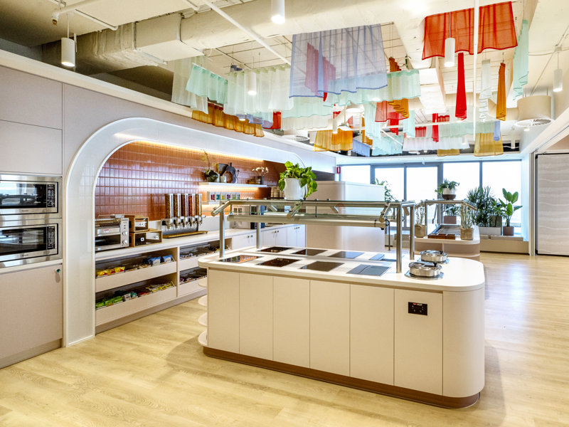 a kitchen with a variety of items from the ceiling