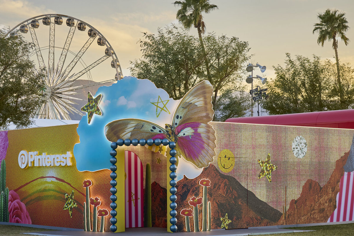 a large inflatable structure with a ferris wheel in the background